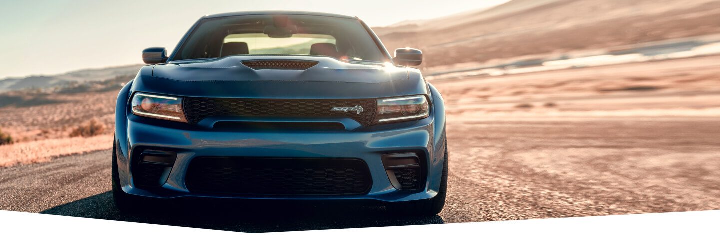 The 2020 Dodge Charger SRT Hellcat Widebody parked on a race track.
