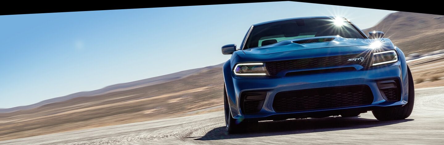 The 2020 Dodge Charger SRT Hellcat Widebody being driven on a race track.